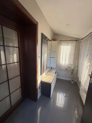 a bathroom with a sink and a toilet in it at Pasarel House in Pasarel