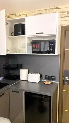 a kitchen with a counter top with a microwave at Luxury studio Perun Lodge in Bansko