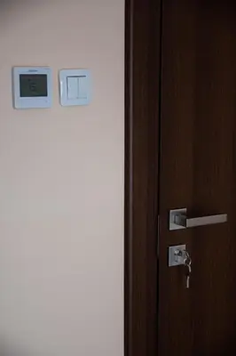 an open door with a clock on a wall at Dzhorgovata Guesthouse in Govedartsi