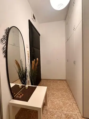 a dressing room with a mirror and a bench at Vinny's Place in Sofia