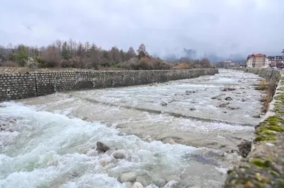 a river with rapids on top of it at Riverside 1BR in Downtown Near Ski Lift by Flat Mаnаger in Bansko