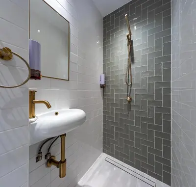 a bathroom with a sink and a shower at Central Sofia 2BR Apt City Center Historic in Sofia