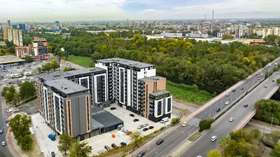 an aerial view of a building next to a highway at ApArt by the river in Plovdiv