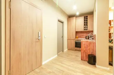 a kitchen with a large wooden door in a room at 1 BR Wine Journey in Sofia