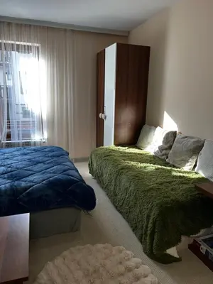 a bedroom with two beds and a window at Green Point Studio O12 in Chepelare