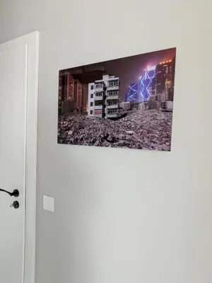 a picture hanging on a wall in a room at Olive Urban Apartment, Free Parking in Sofia