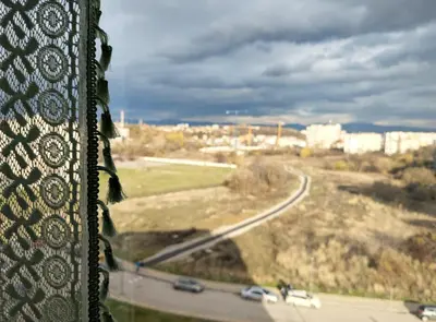 a view from a window of a road with cars at Olive Urban Apartment, Free Parking in Sofia