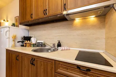 a kitchen with a sink and a refrigerator at Vacation Home in Starosel Resort in Starosel