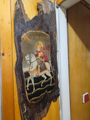 a painting of a man riding a horse on a wall at Affordable 3BR near Centre in Sofia