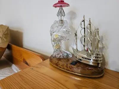 a clock on top of a wooden table at Affordable 3BR near Centre in Sofia