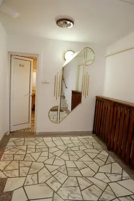 a room with a mirror on the wall and a hallway at Hotel Mishel in Kocherinovo
