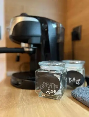 a coffee maker and two glass jars on a table at ViVa SPA Retreat in Velingrad