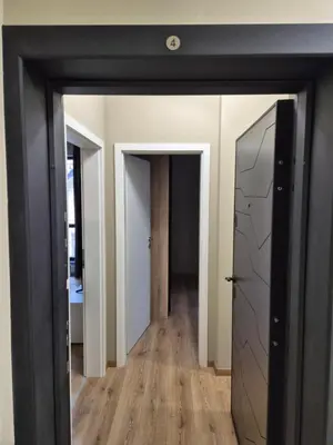 a room with a hallway with a mirror and a door at SUPERsonicondo 4 in Plovdiv