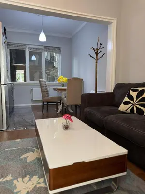 a living room with a couch and a coffee table at Central Elegance NDK 3BDR in Sofia