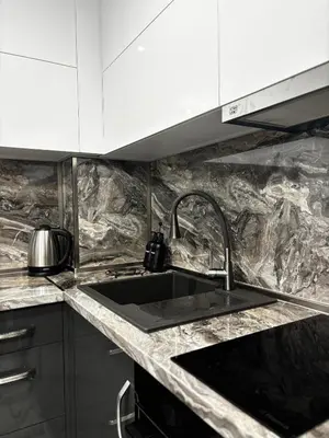 a kitchen with a sink and a counter top at Thermal Bliss Apartment in Velingrad