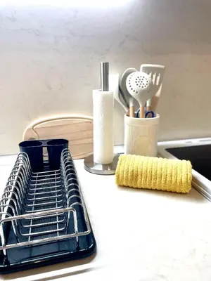 a drying rack with a sponge next to a sink at 1BR Apartment Near Gondola by SI Stay in Bansko