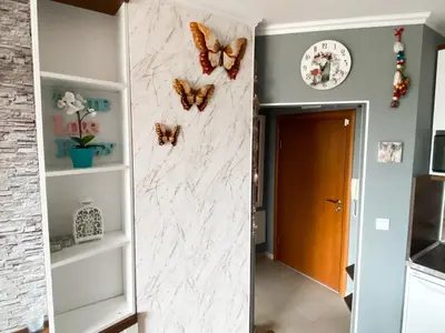 a hallway with butterflies on the wall at Belvedere Holiday Club H70 in Bansko