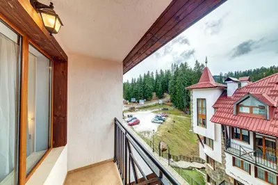 a balcony of a building with a view of a parking lot at Alpine Hideaway at The Castle in Smolyan