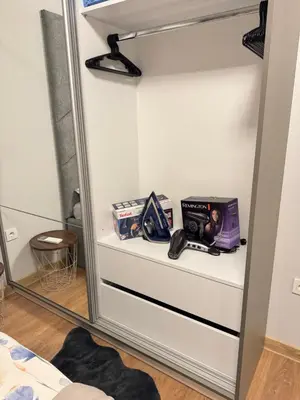 a shelf in a closet with a mirror at Plovdiv Moon - 1 Bedroom Luxury Apartment in Plovdiv