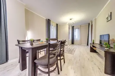 a dining room with a table and chairs at Warm Mountain Hideout in Pamporovo
