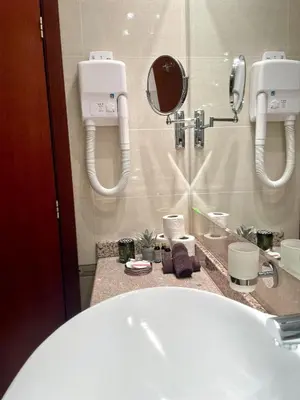 a bathroom with a white sink and a mirror at Cozy 1BR next to the Gondola by SI Stay in Bansko