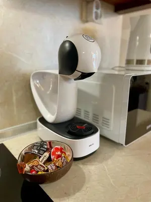 a mixer on top of a microwave with a bowl of food at Cozy 1BR next to the Gondola by SI Stay in Bansko