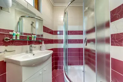 a bathroom with a sink and a shower at Slopeview Stay at Grand Monastery in Pamporovo