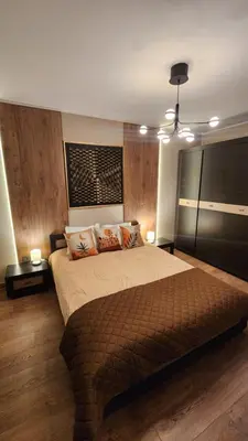 a bedroom with a large bed with two pillows at SPOMAR One Bedroom Apartment in Bansko