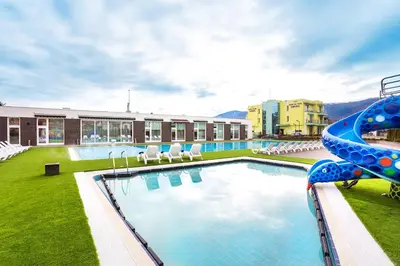 a large swimming pool with a water slide at Complex Europe in Dolna Banya