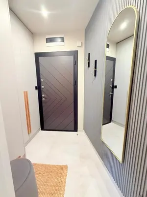 a bathroom with a door and a mirror at Lux Boutique 2 BDR apartment right next ski gondola lift in Bansko