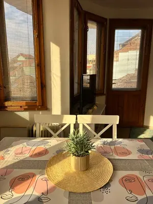 a room with a table with a plant on it at Cu29 Kapana art Apartments in Plovdiv