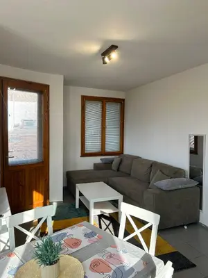 a living room with a couch and a table at Cu29 Kapana art Apartments in Plovdiv