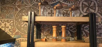 a wooden shelf with bottles on a wall at Amore Grande in Beli Iskar
