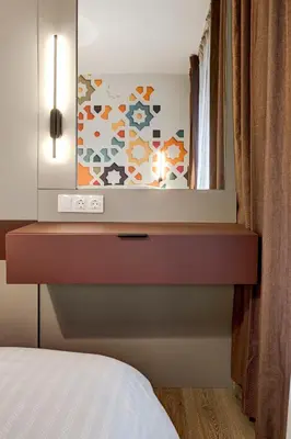 a bedroom with a dresser with a mirror at Newly Renovated Comfortable First-Floor Stay in Sofia