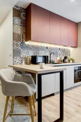 a kitchen with a wooden table with a chair at Newly Renovated Comfortable First-Floor Stay in Sofia