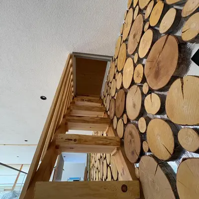 a room with a stack of logs on the wall at Loft Chalet Bansko in Bansko