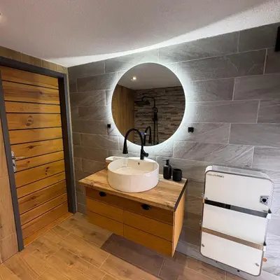 a bathroom with a sink and a mirror at Loft Chalet Bansko in Bansko