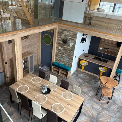 an overhead view of a table and chairs in a room at Loft Chalet Bansko in Bansko