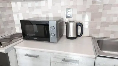 a microwave sitting on top of a kitchen counter at Аpartment C103 Grand Bansko 1 in Bansko