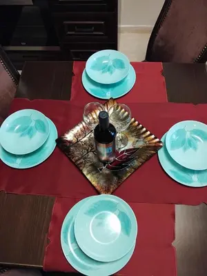 a table with blue and white plates on a red table cloth at Ski point in Pamporovo