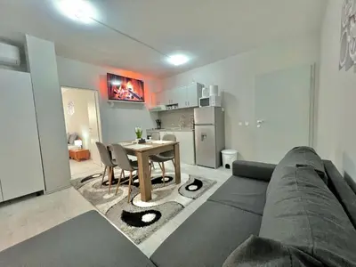 a living room with a couch and a table at 2BR Snowflake Stay Bansko by SI Stay in Bansko