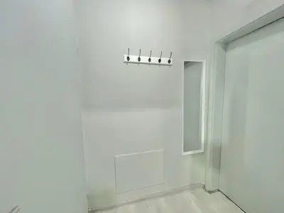 a white room with a row of lights on the wall at 2BR Snowflake Stay Bansko by SI Stay in Bansko