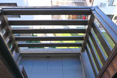 a view from the top of a balcony of a building at Comfortable 2-Bedroom Apartment Near the Ski Lift by Flat Mаnаger in Bansko