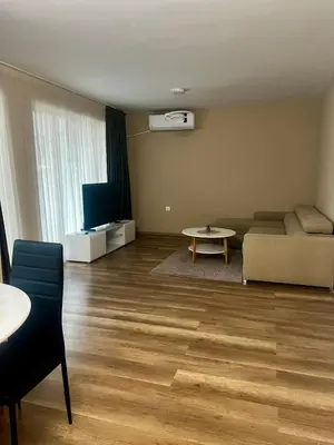 a living room with a couch and a table at Raya - Apartmant in Plovdiv, with private parking in Plovdiv