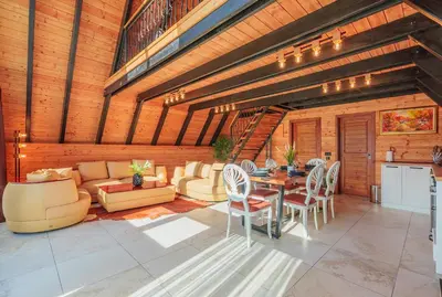 a living room with a table and chairs at Camping Between the Mountains Bansko in Bansko