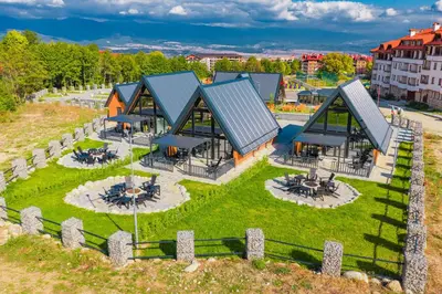an aerial view of a building with a yard at Camping Between the Mountains Bansko in Bansko