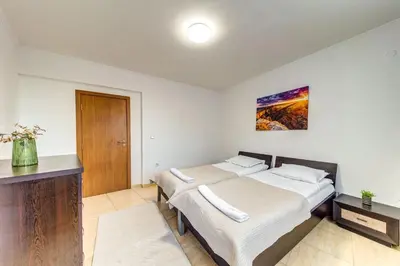 a bedroom with two beds in a room at Two-bedroom Apartment in the Heart of the Rhodopes in Pamporovo