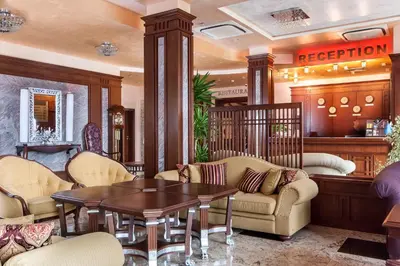 a living room with a table and chairs at Hotel Chiirite in Plovdiv