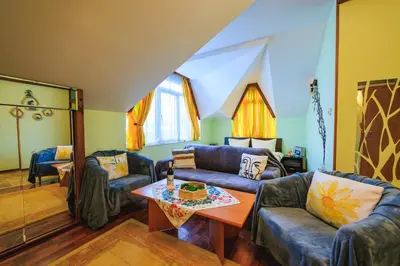 a living room with a couch and a table at Fantasy in Bansko