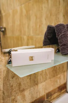 a white box sitting on a shelf in a bathroom at Fantasy in Bansko